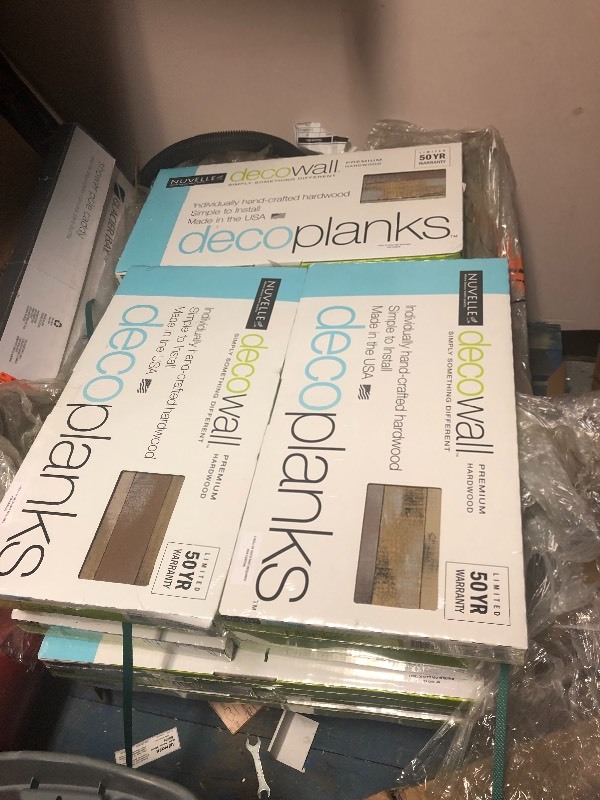 lot 154 image: 20 cases Nuvelle Deco Planks Weathered 12 in. Thick x 2 in. Wide x 12 in. Length Solid Hardwood Wall Planks not used Retails $99case