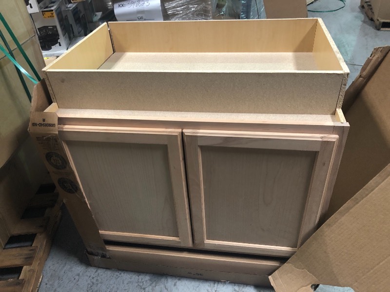 lot 159 image: Hampton Bay Hampton Assembled 30x34.5x24 in. Base Kitchen Cabinet in Unfinished Beech not used whit small dents on the side