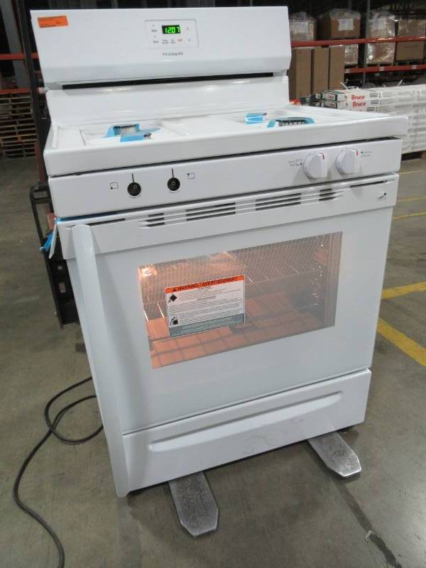 lot 11 image: Frigidaire 30 in. 5.0 cu. ft. Gas Range with Manual Clean in White FCRG3015AWA - Missing two knobs and has slight damage on handle and LH Side.