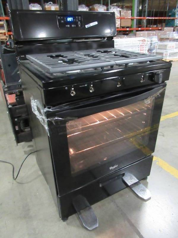lot 15 image: Whirlpool 5-Burner 5.1-cu ft Freestanding Gas Range (Black) 30 WFG505M0BB - Door needs to be re attached, Missing 4 Knobs and 3 Burner Caps