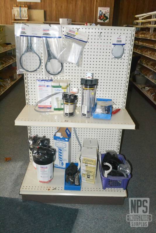 lot 80 image: Contents of Shelf 28,29 and Items on Pegboard above Shelf 28  - Assorted Water Filter Cartridges, Canisters and Wrenches