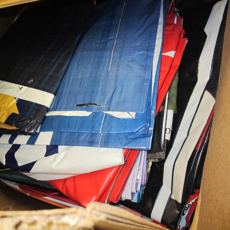lot A1 image: Pallet of mixed 13 oz Recycled Billboard Tarps - Medium-Heavy Duty - Print on 1 Side - 6417 sq ft - 483 lbs