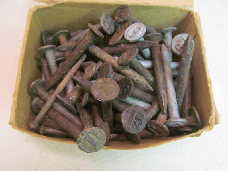 lot 106 image: Numbered railroad nails