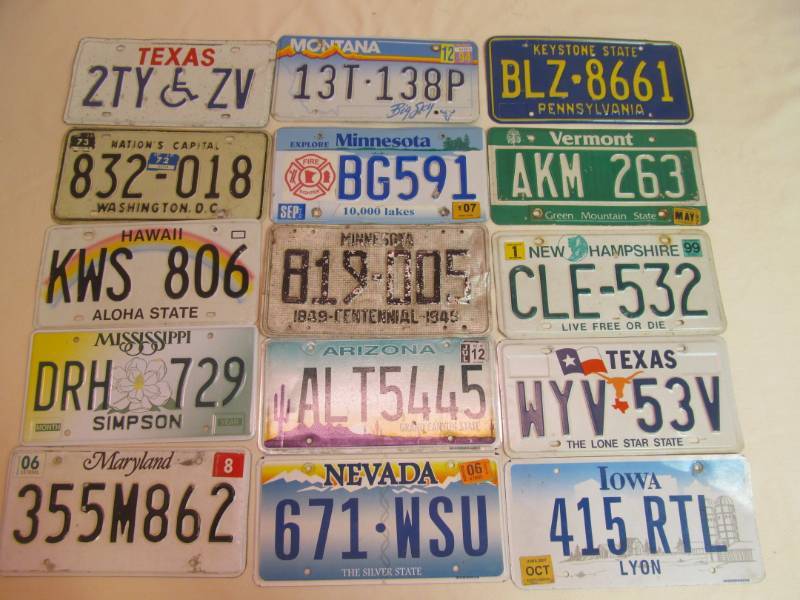 lot 143 image: vintage license plates