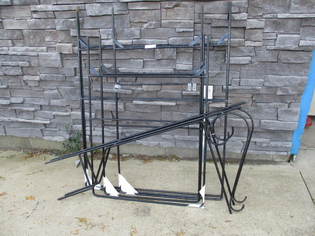 lot 58 image: Pile of new round steel sign frames