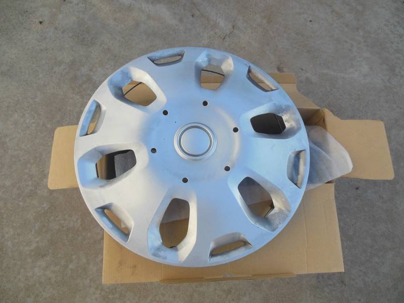 lot 242 image: THREE Used Hub Caps off of a Ford Transit Van -  Great WALL ART