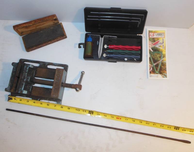 lot 76 image: Lansky Sharpeners  Kit (missing one stone), Vintage Sharpening Stone in Box, Shop Fox Vice and 26 inch Handleless Flathead Screwdriver