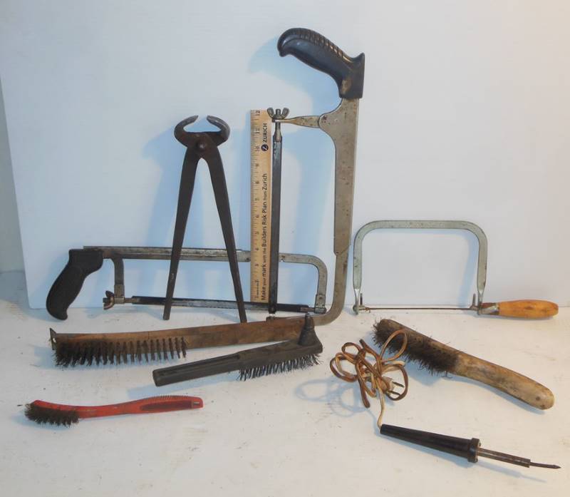 lot 92 image: Hand Saws, Wire Brushes, Old Soldering Iron and an Elephant Tooth Puller (lol)