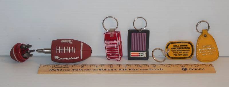 lot 103 image: Michigan Industrial Tool Ergonomic Football Screwdriver Kit, Snap-on Key Chain, K & N Filters Key Chain and Two More