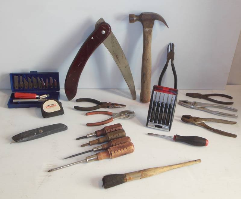lot 126 image: Used Tools (to varying degrees - see photos) Including Hand Saw, Hammer, Snips, Mini Tool Kit, Screwdrivers, Tape Measure, Pliers, Box Cutter, and Brush