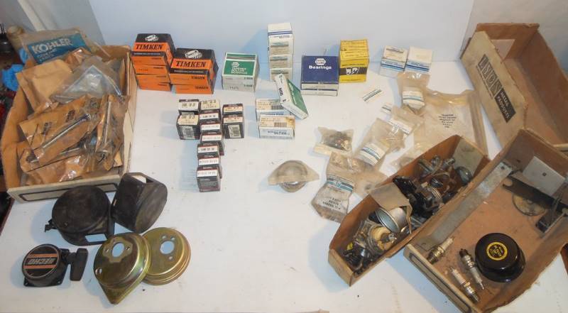 lot 139 image: PARTS Majority are New in Package (most packaging appears to be undisturbed) Timken and Napa Tapered Roller Bearings, Wisconsin Robin Point Condenser Kit  206-70102-07, 13 Kohler  Intake and Exhaust