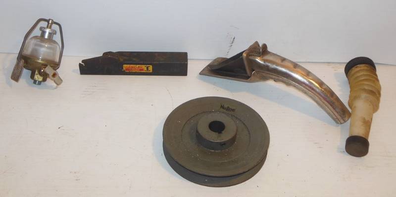 lot 169 image: Glass Fuel Filter  - Marvel Schebler Tillotson OW810 MS51086-1, J-Mark Model No. 1 Lube Spout, Sandvik Coromant TMax R150.21-2525-5 (possible lathe tool holder or part of one), (Component of) NuLine Pulley BK52 - 34 and plastic spout - just because.