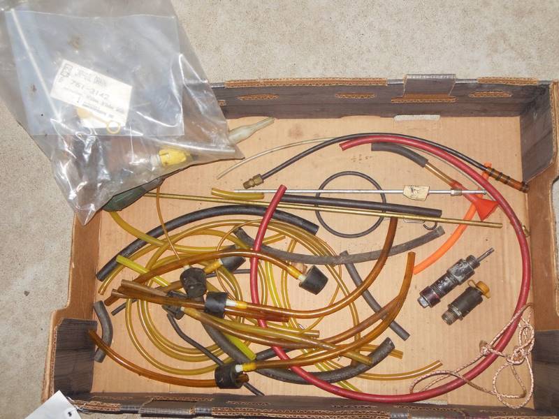 lot 165 image: Oil and Fluid Filling Components Including Oil Drain Valves, New Cap (Cub Cadet) and Tube
