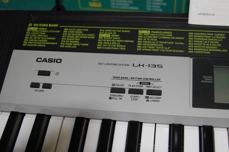 lot 21 image: Casio LK-135 Portable Lighted (Illuminated Keys) Digital Keyboard  Piano  Organ