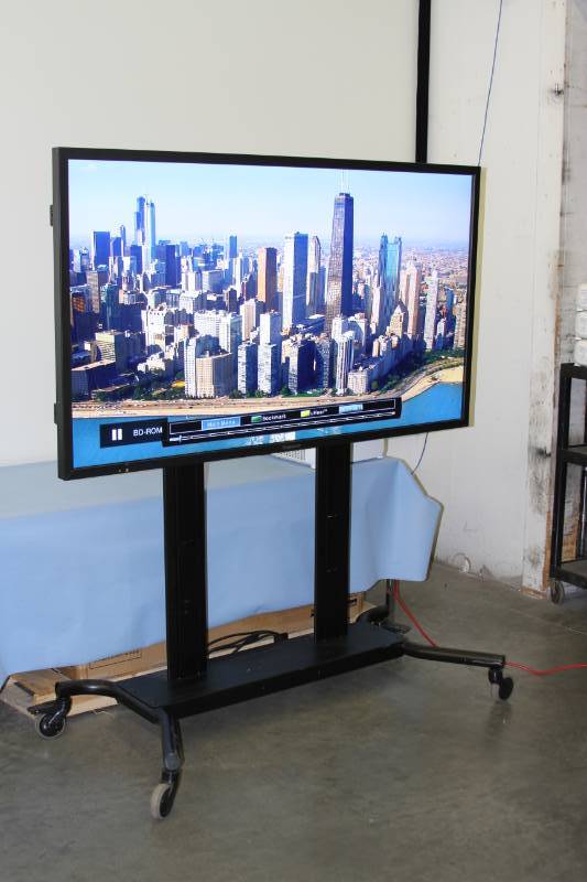 lot 1 image: Panasonic Professional  Commercial Full-HD LED  LCD Display  Monitor & Peerless Heavy-Duty Rolling Mobile Stand
