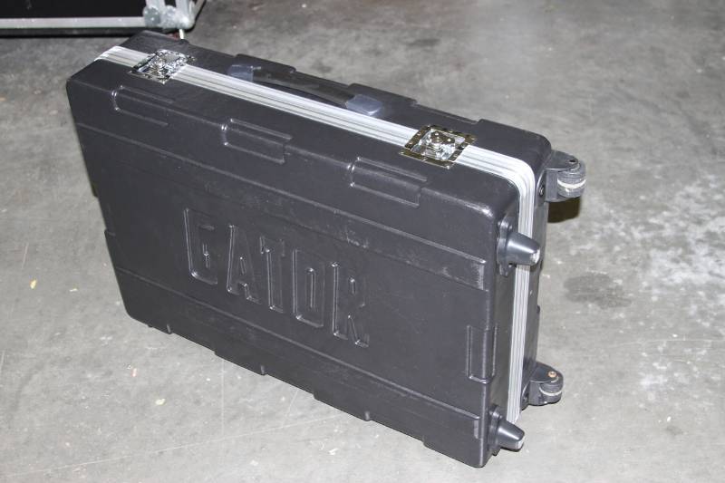 lot 58 image: Gator Molded Hardshell Hard-Sided Travel Storage Case with Telescoping Handle & Casters