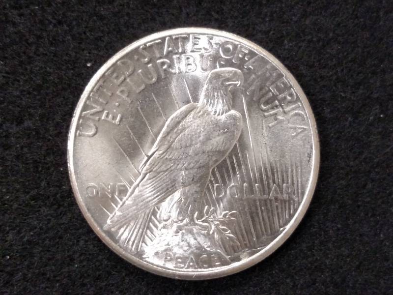 lot 79 image: 1925 High Grade Peace Silver Dollar...