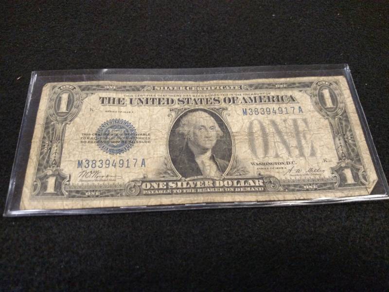 lot 180 image: 1928 A One Dollar Funny Back Silver...