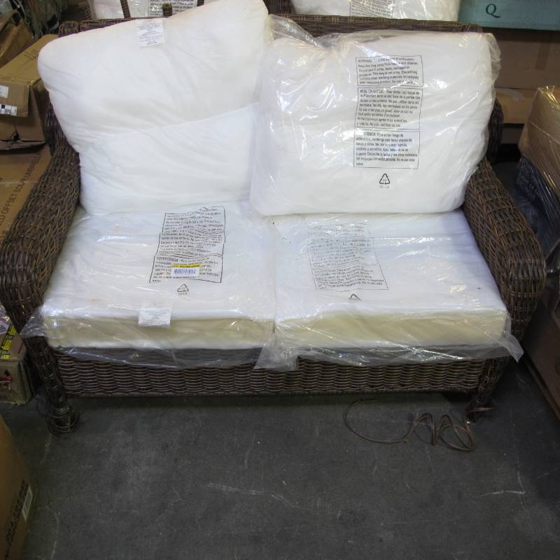 lot 32 image: Cambridge Brown Wicker Outdoor Patio Loveseat with Bare Cushions - Wicker Coming off Legs