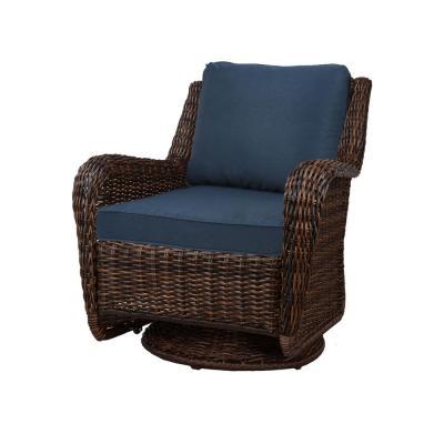 lot 49 image: Pair of Hampton Bay Cambridge Brown Wicker Swivel Outdoor Rocking Chair with Bare Cushions