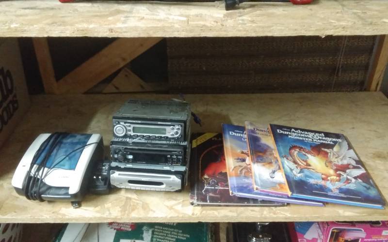lot 15 image: 3-Car Stereos, 4-Dungeon Dragon Books, Panini Check Scanner