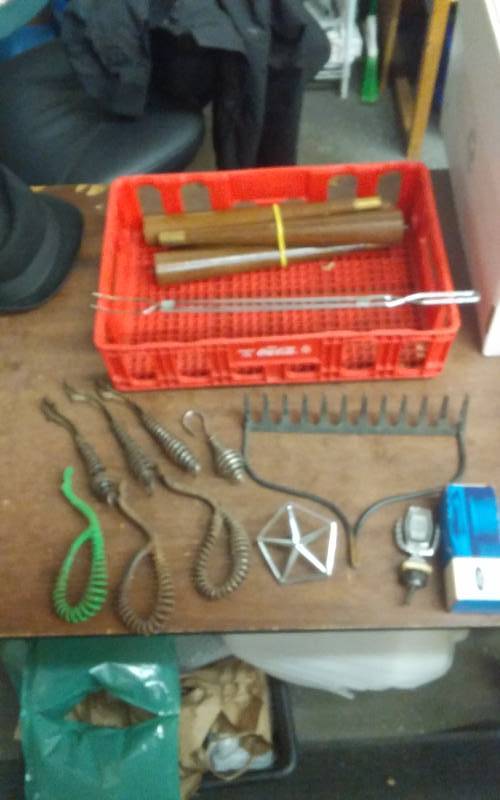 lot 39 image: Coca Cola Crate, Set Of 4 Legs, Collection Of Old Cast Iron Lid Lifters (For Cast Iron Stoves), Hard Rake Head, 2-Hood Ornaments