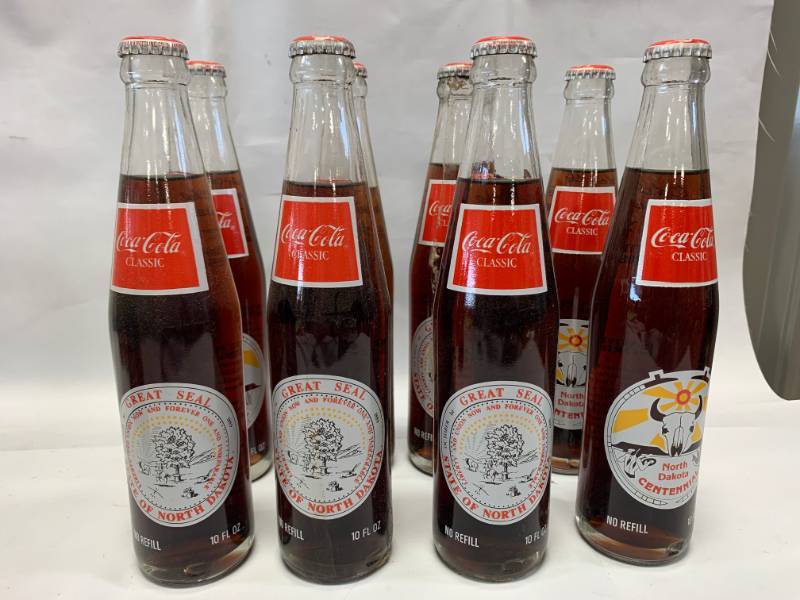 lot 80 image: Lot of 8 North Dakota Coca Cola Bottles