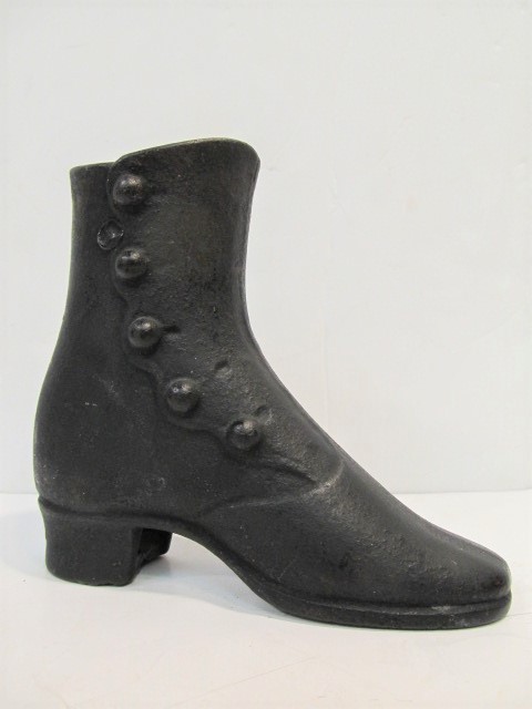 lot 128 image: Antique Victorian Ladies Cast Iron Boot