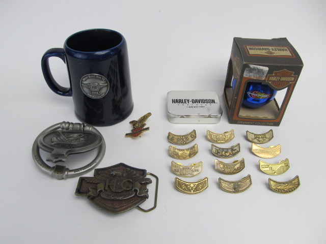 lot 93 image: Group of HARLEY DAVIDSON Motorcycle HOG Club Pins Belt Buckle Door Knocker etc