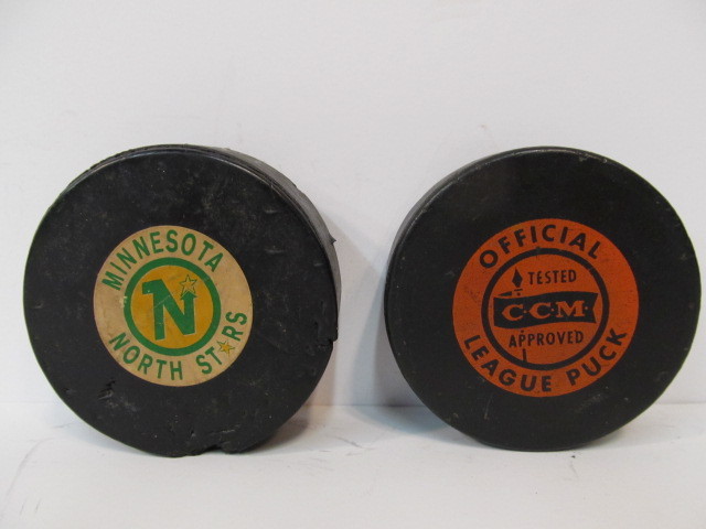 lot 271 image: Original 1960s NHL Hockey Pucks Including MN North Stars