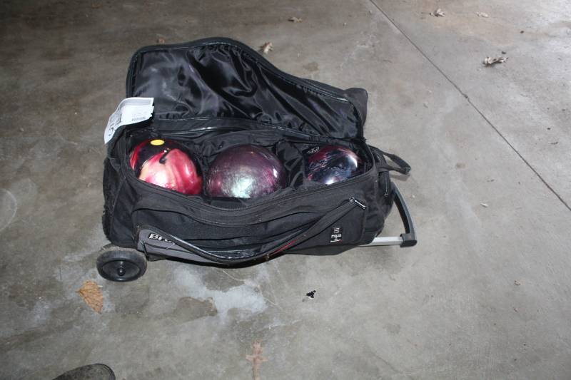 lot 551 image: Lot of (3) Bowling Balls with Rolling Carrier
