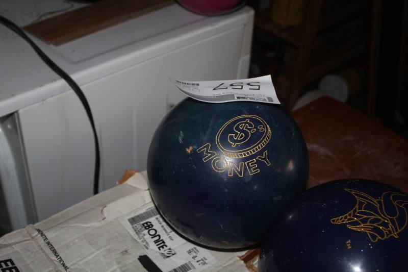 lot 557 image: $Money Bowling Ball Undrilled