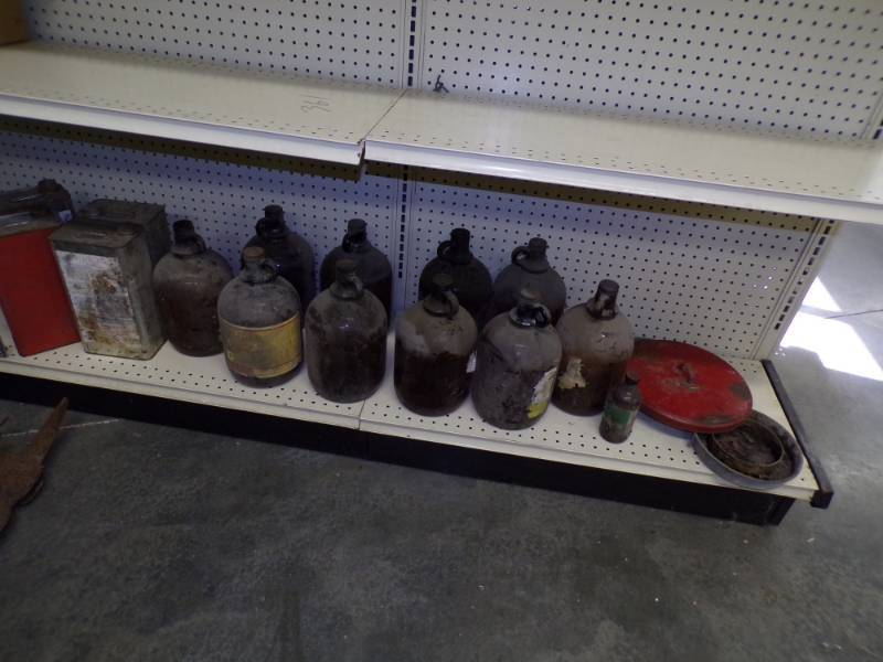 lot 44 image: 1 Gallon Glass and Tin Bottles
