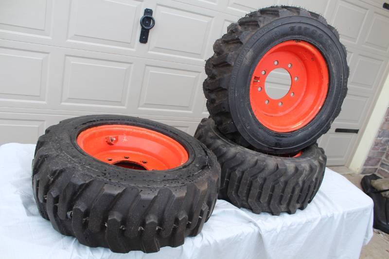lot 212 image: Lot of (3) Firestone Severe Service 26065D15 Bobcat Tires with Wheels