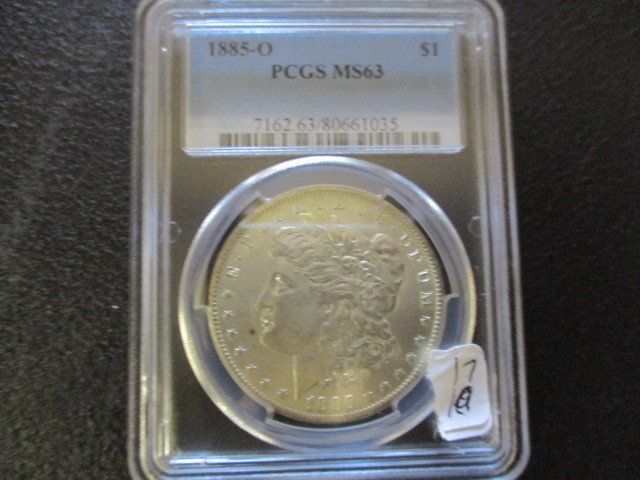 lot 17 image: PCGS 1885-O MS63 Morgan Silver Dollar
