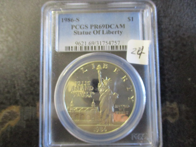 lot 24 image: PCGS 1986 PR69 DCAM Statue of Liberty Ellis Island One Dollar