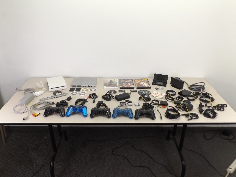 lot 29 image: Large Lot of Misc PS2, Wii, etc. Video Game Consoles, Cords, etc.