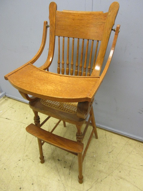 lot 716 image: SOLID OAK HIGH CHAIR WITH CANE SEAT