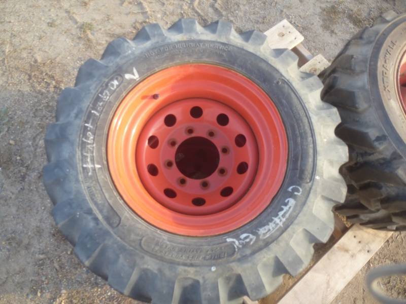 lot 12 image: Skid steer TireRim Set