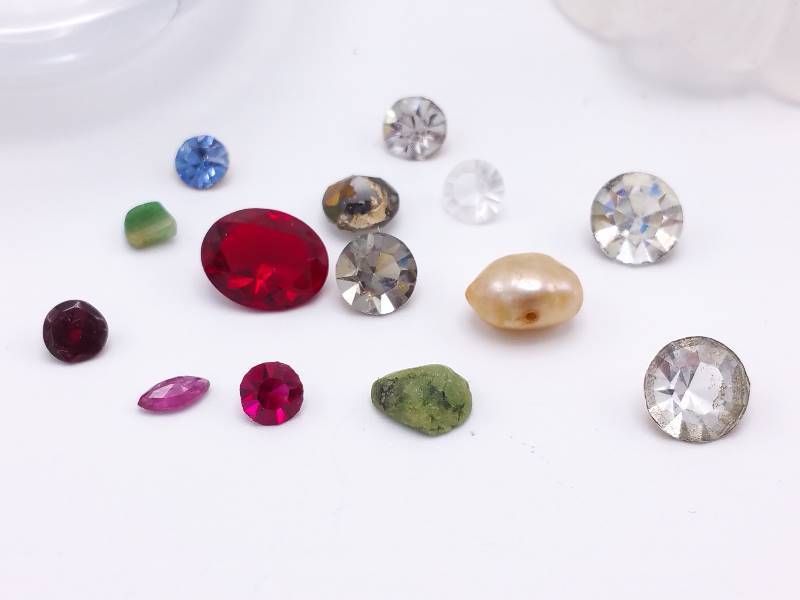 Group of Loose Stones including a Natural Ruby and Barouque Pearl in a Lovely Dresser Bottle w Stopper