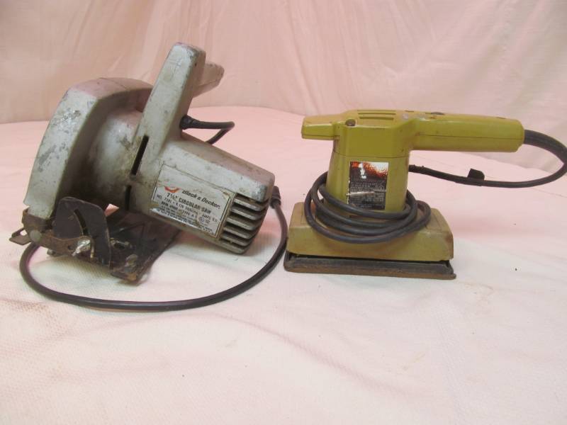 lot 21 image: vintage Black and Decker circular saw and sander