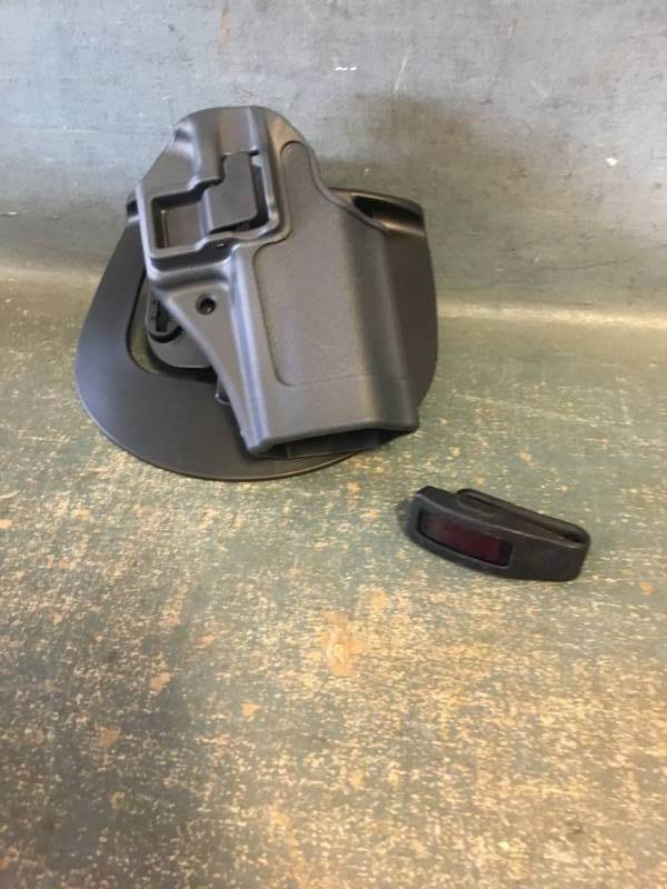 lot 26 image: Blackhawk Holster and FitBit Inspire