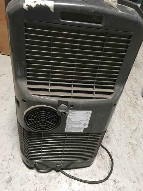 lot 34 image: Whynter 12,000 BTU Portable Air Conditioner with Dehumidifier and Remote  USED MISSING ONE WHEEL