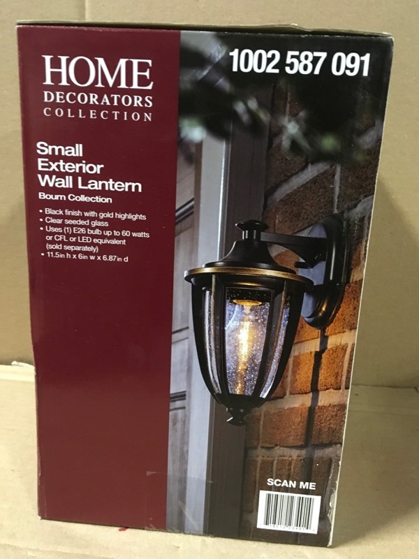 lot 116 image: Home Decorators Collection 1-Light Black with Gold Highlights Outdoor 6 in. Wall Lantern Sconce with Clear Seedy Glass not used