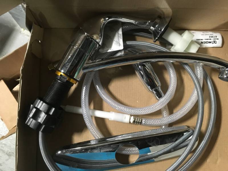 lot 104 image: MOEN Adler Single-Handle Low Arc Standard Kitchen Faucet with Side Sprayer in Chrome- good condition