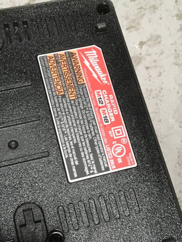 lot 31 image: Milwaukee M12 and M18 12-Volt18-Volt Lithium-Ion Multi-Voltage Rapid Battery Charger- good condition