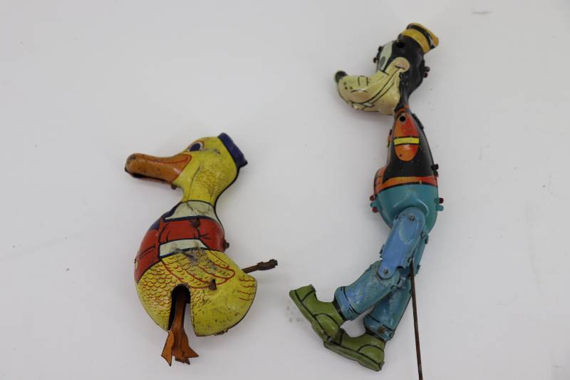 lot 39 image: (2) Old Metal Toys