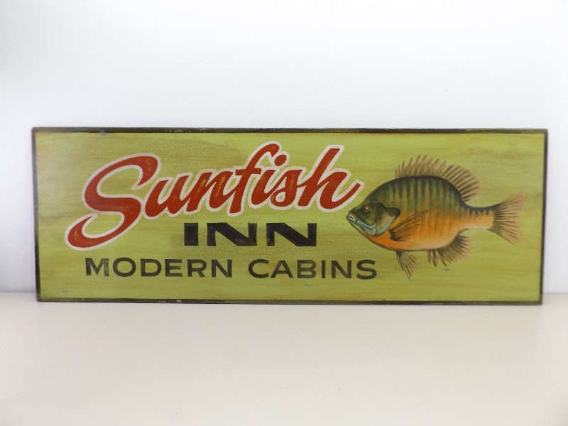 lot 31 image: Large Wood Painted Sunfish Inn Cabin Sign