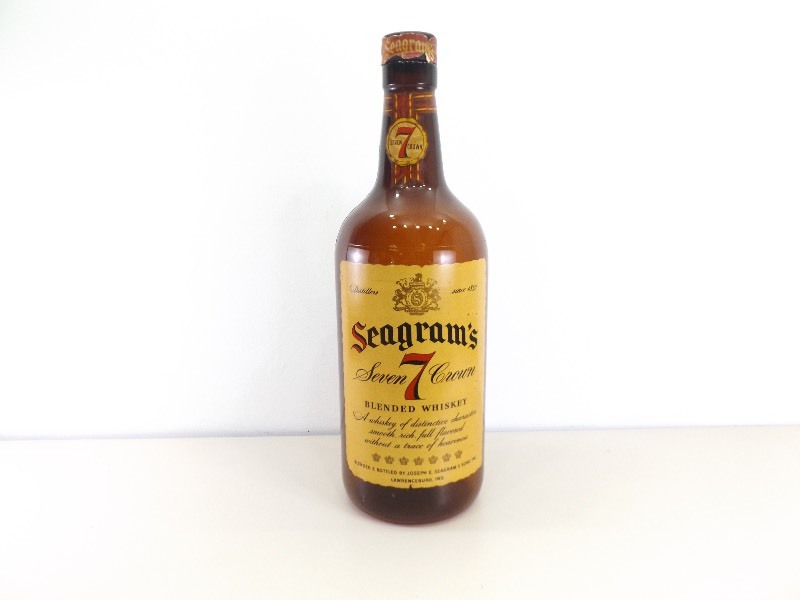 lot 33 image: 29 Tall Large 1940s Seagrams Crown 7 Whiskey Bottle