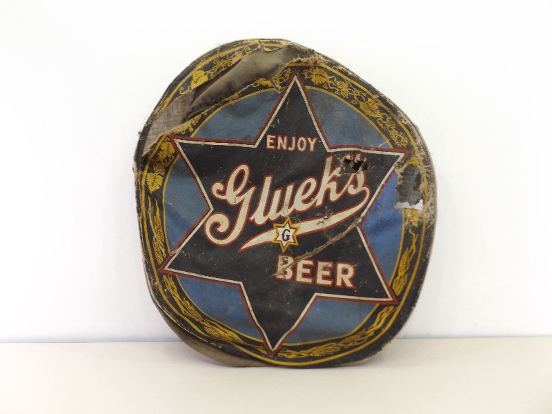 lot 48 image: Antique Hand Painted Canvas Glueks Delivery Truck Wheel Cover